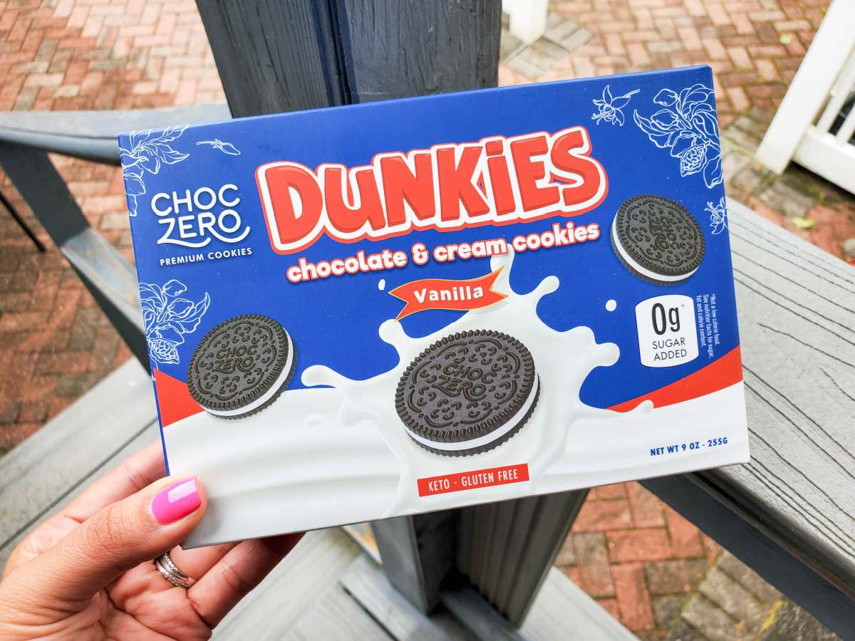 hand holding a box of ChocZero Dunkies Sandwich Cookies from the low carb June keto krate box