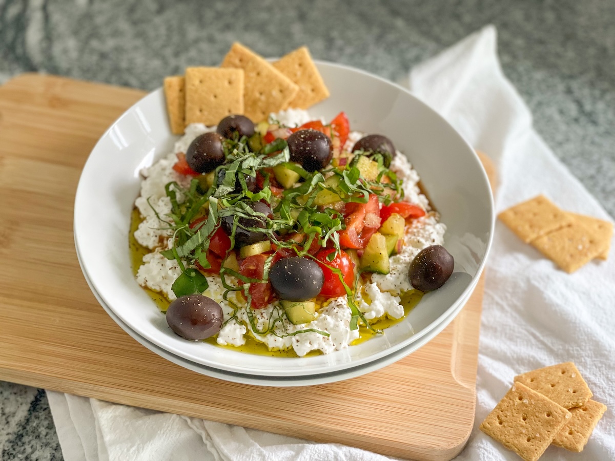 plated cottage cheese salad with almond flour crackers 