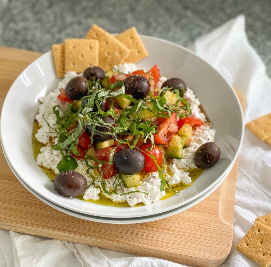 plated cottage cheese salad with almond flour crackers 