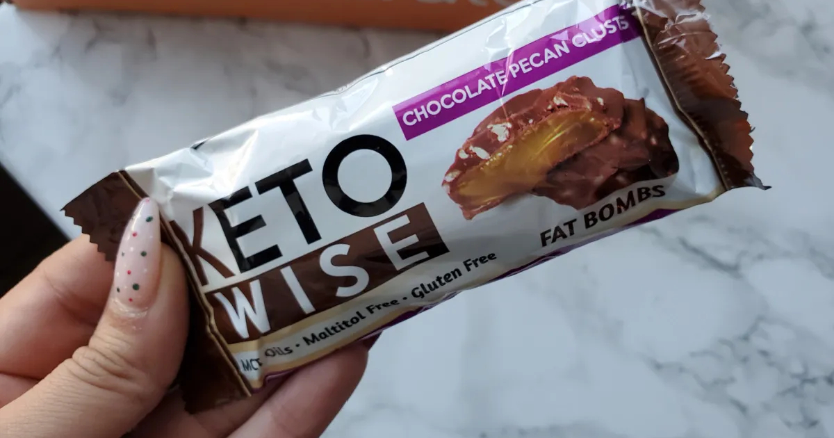 holding a package of keto fat bombs