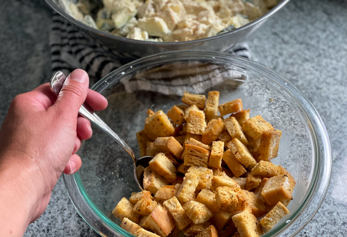 mixing keto croutons in a bowl
