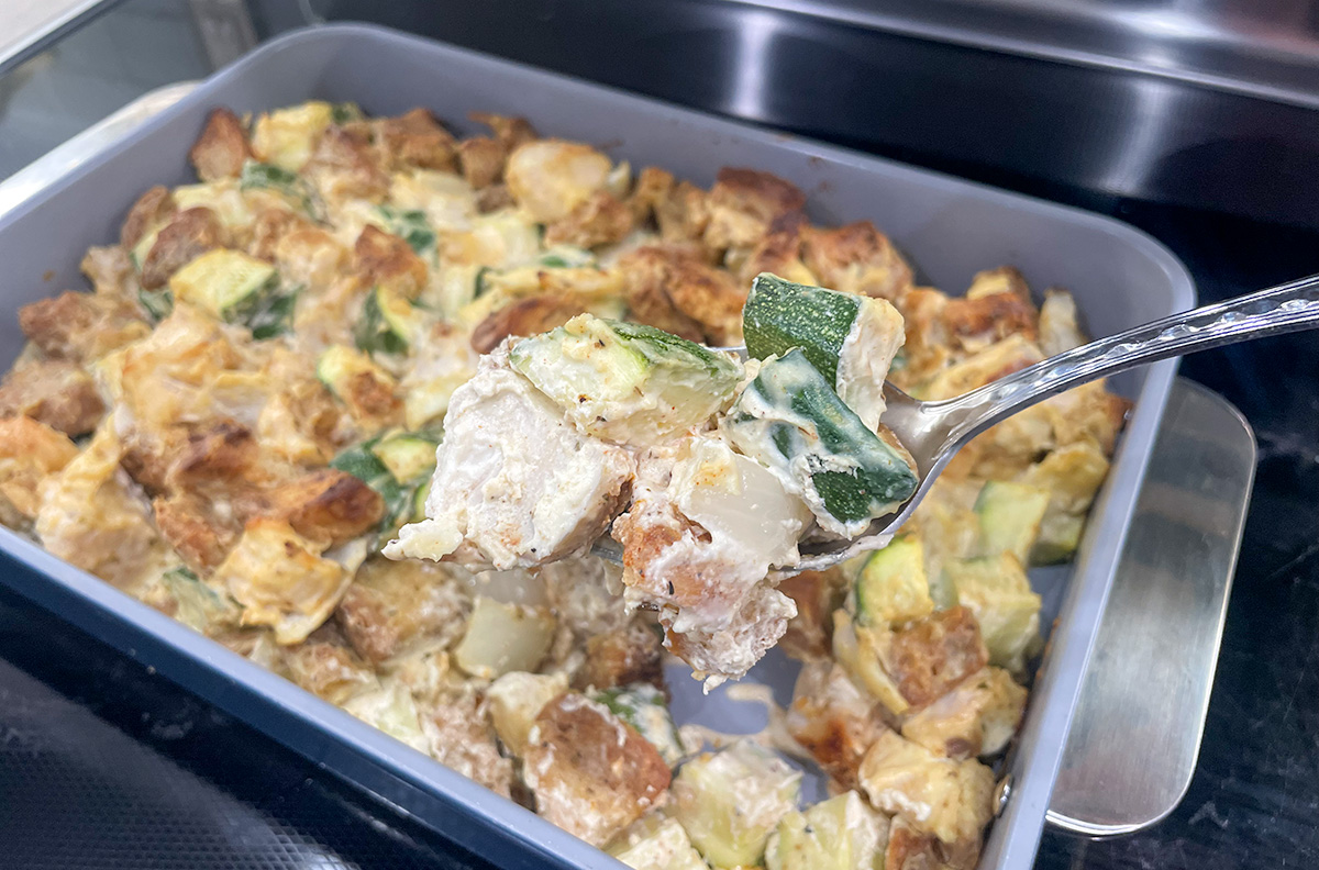 keto zucchini casserole being served from pan
