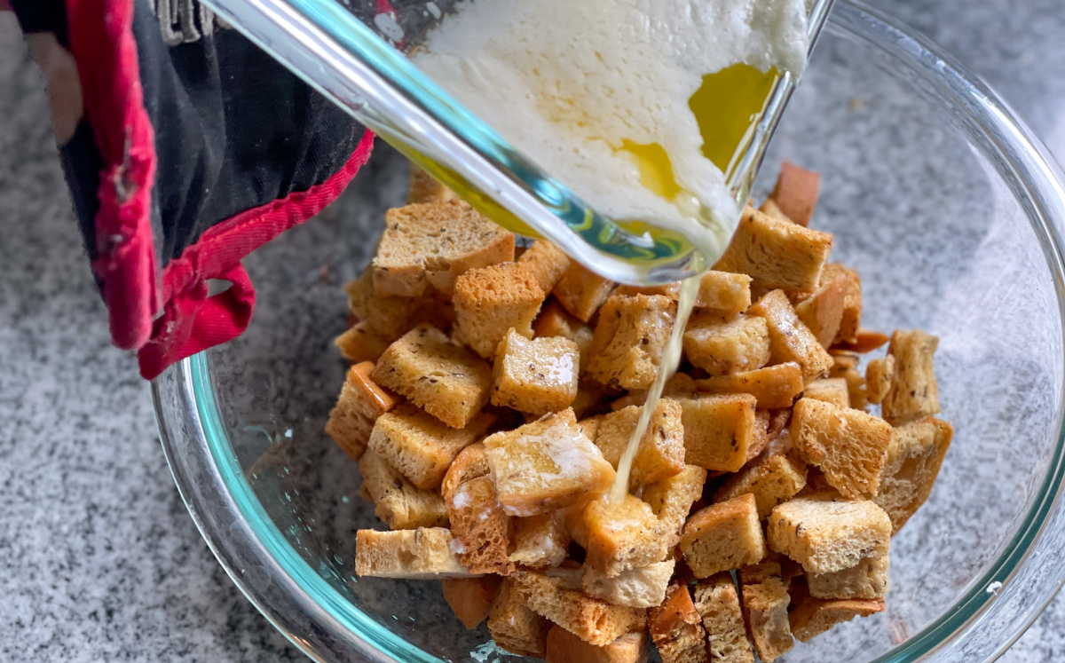 pouring butter onto keto croutons
