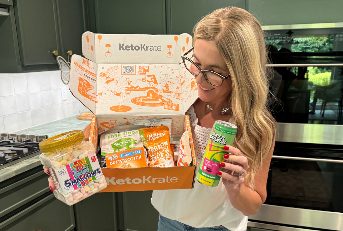 woman holding keto krate box with keto-friendly snacks