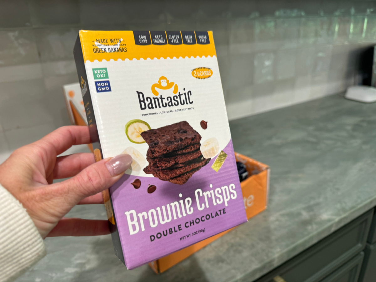 Hand holding up a box of Bantastic Brownie Bites which were part of the August 2024 Keto Krate Snacks
