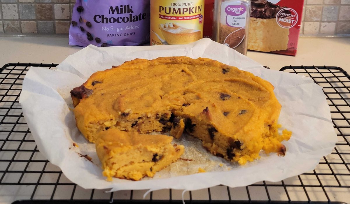 A keto pumpkin cake next to low carb baking ingredients