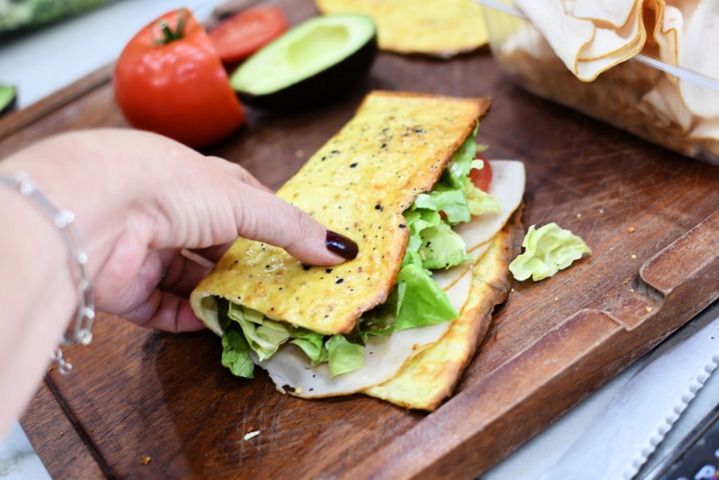 making a sandwich with homemade cottage cheese bread 