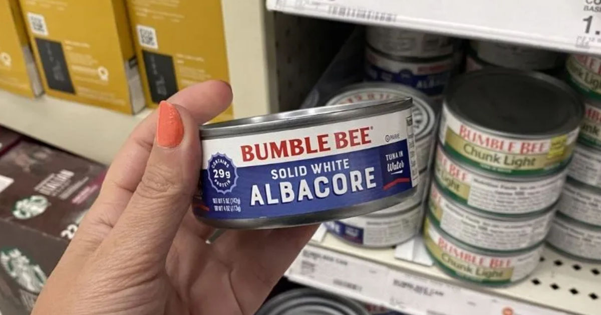 holding a can of Bumble Bee tuna