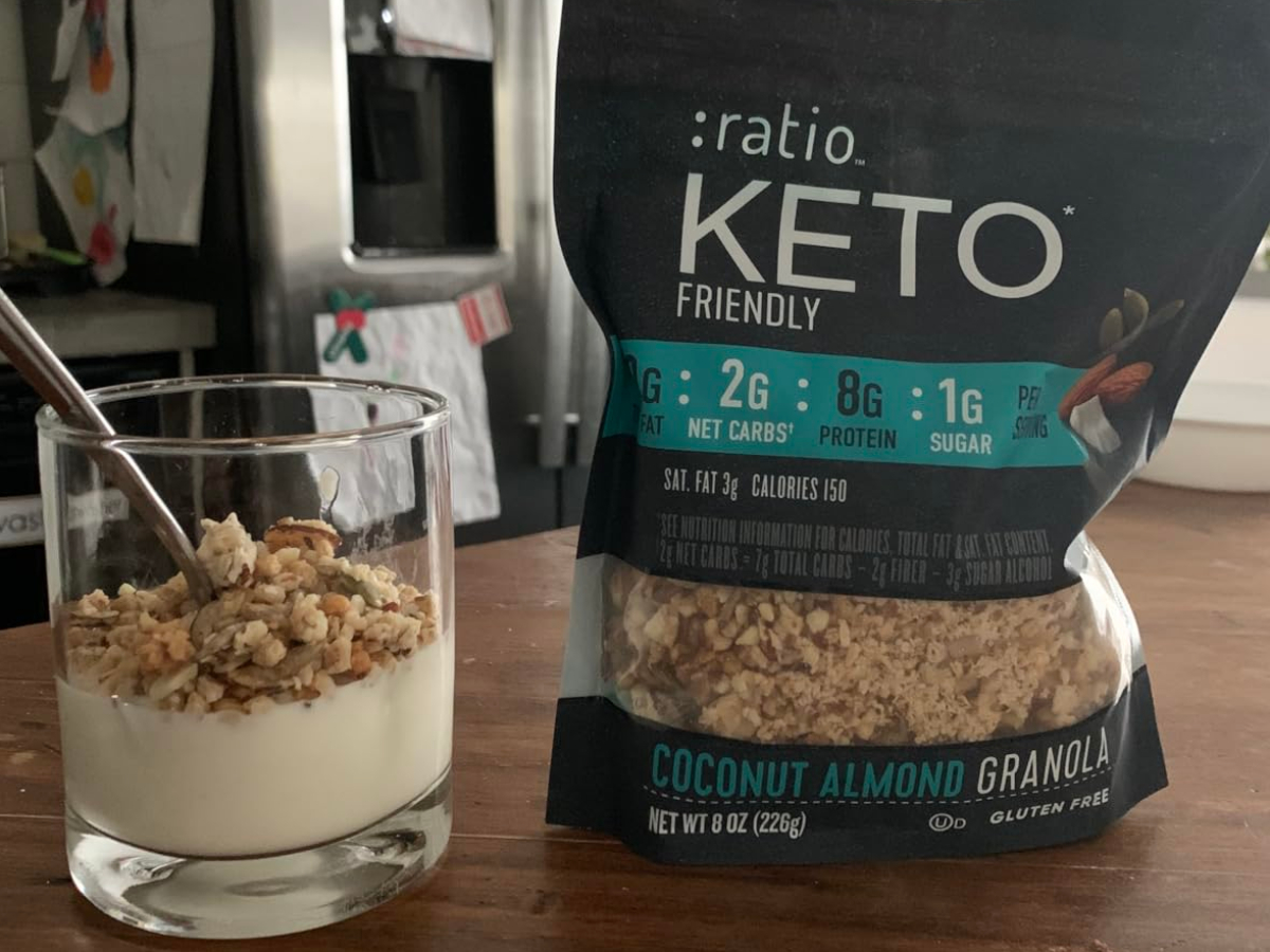 bag of keto granola next to parfait in a glass