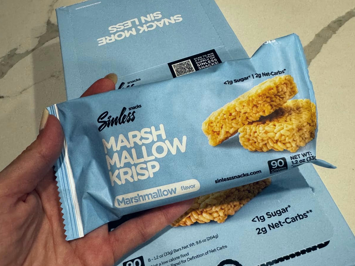 holding a packaged keto marshmallow rice treat