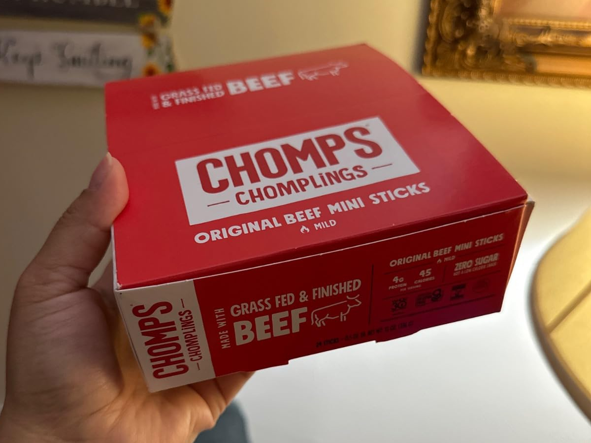 holding a red box of beef sticks
